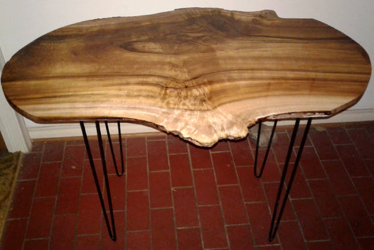 Myrtle slab with mirror coat finish and hairpin legs